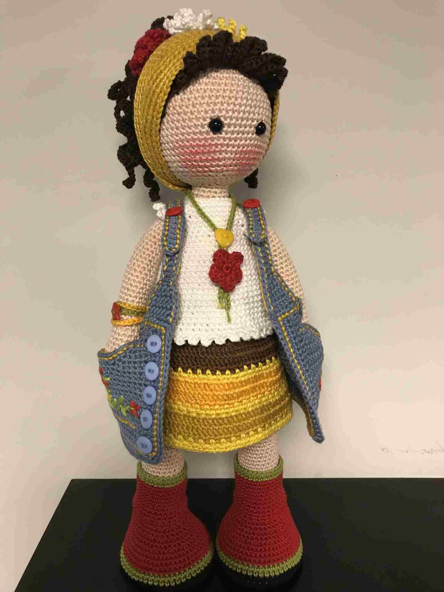 Handmade crochet doll in denim and yellow bonnet